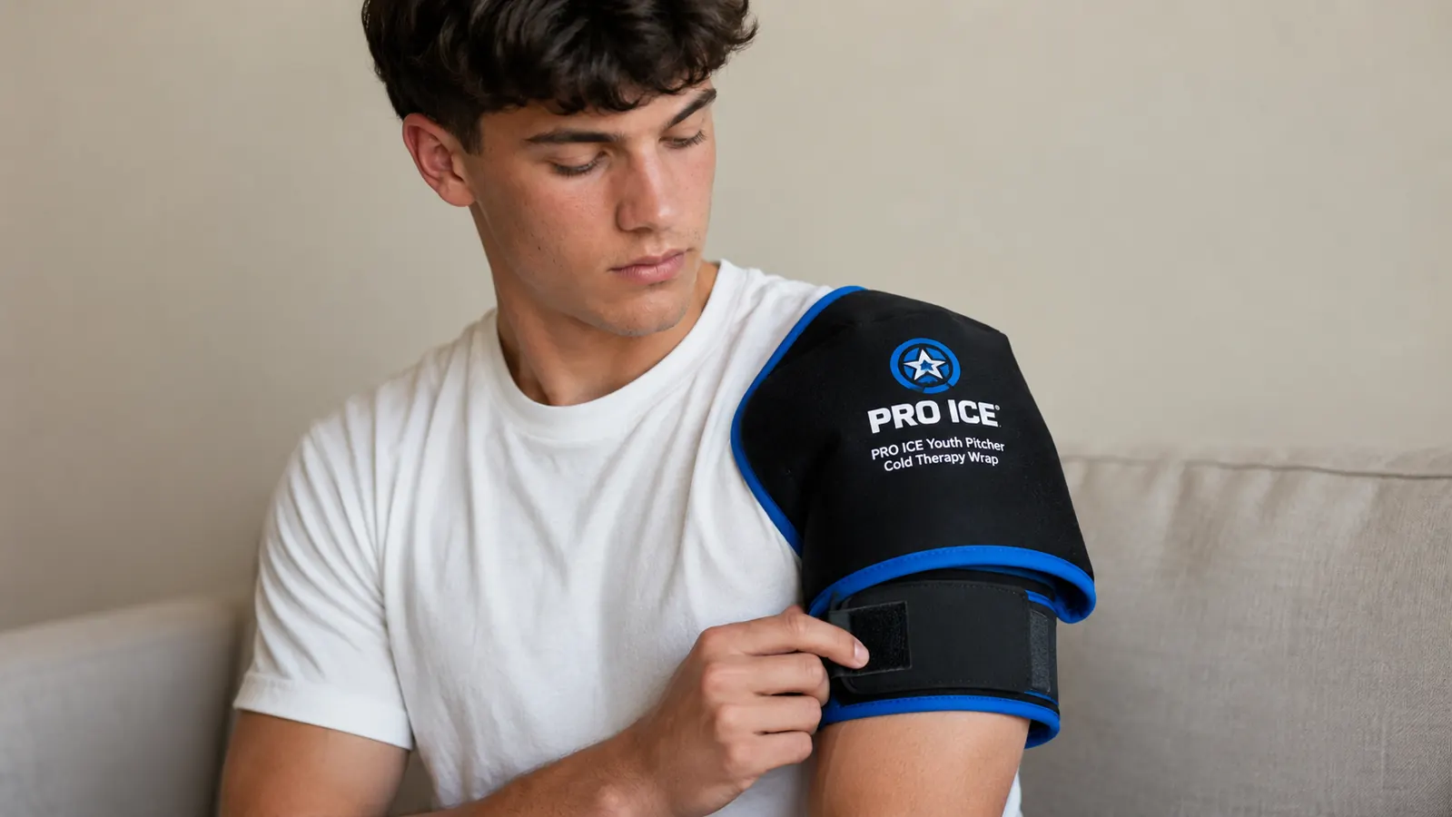 Teen pitcher wearing the PRO ICE wrap on his shoulder position rather than elbow, showing the alternate placement